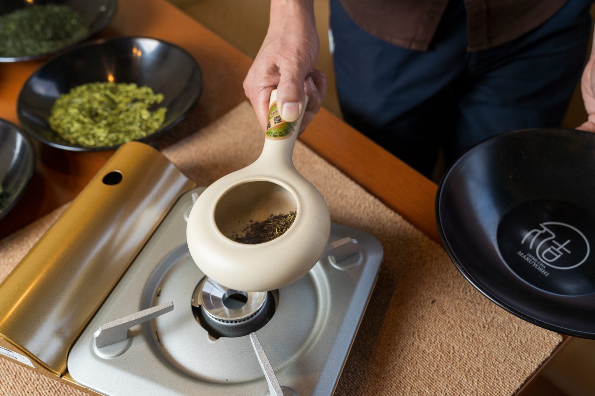 A close-up look at the master roasting tea differentiated by roasting time, aroma, and color.