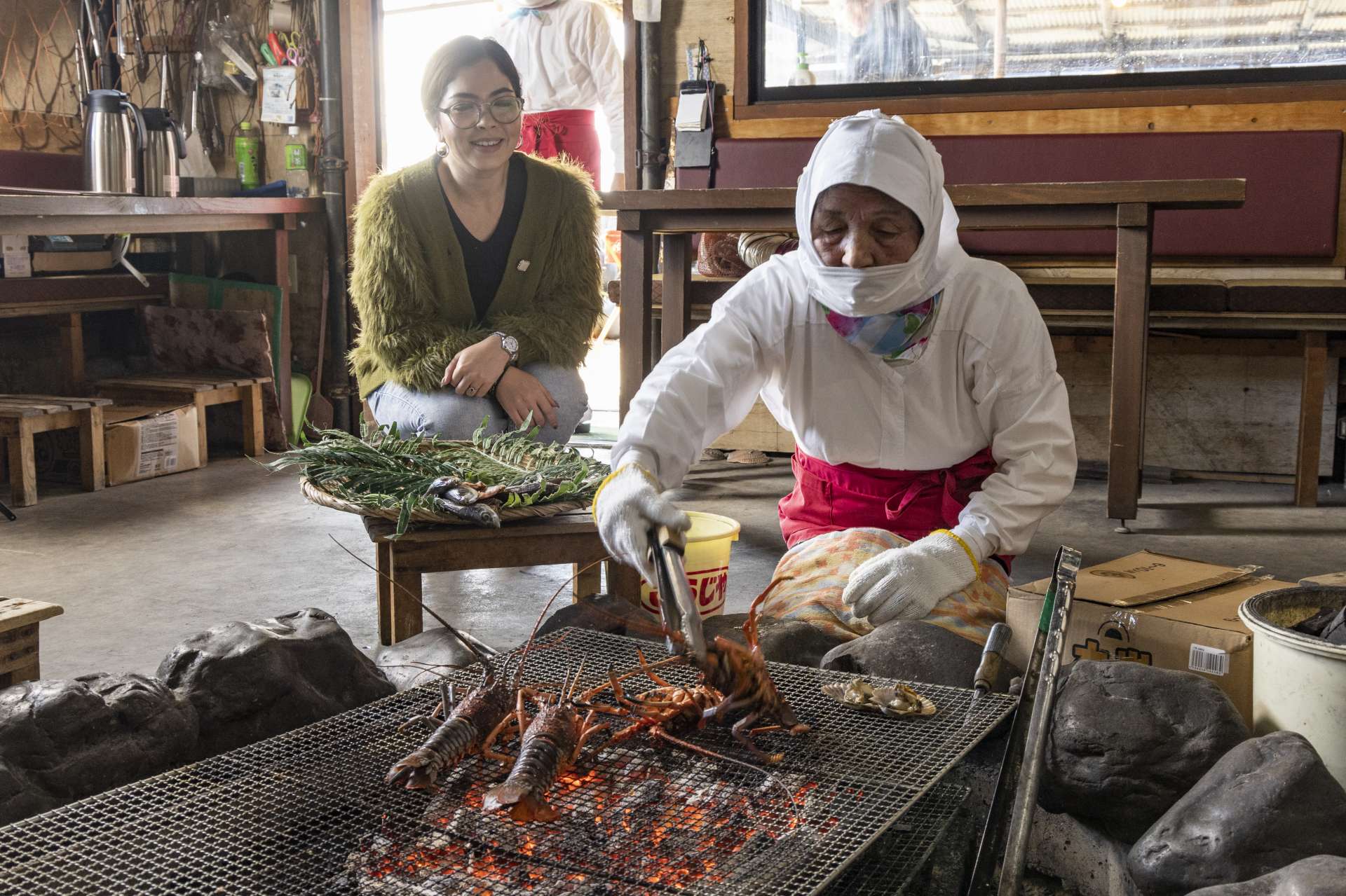 The ama women grill their fresh bounty for us, right in front of our eyes.