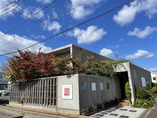 Stylish exterior with unfinished concrete.