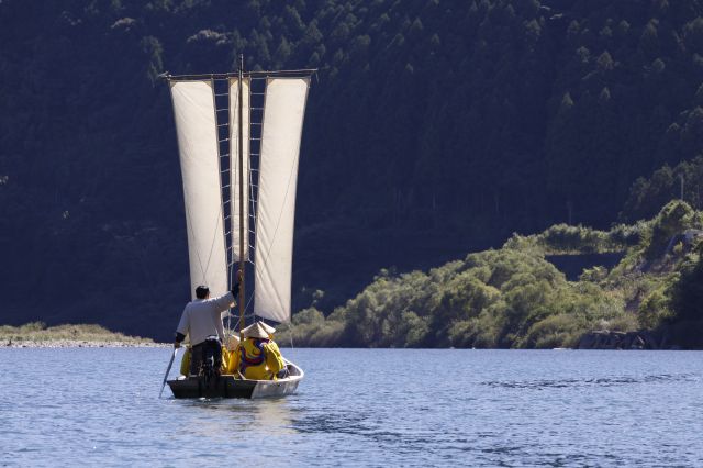 A Sandanbo riverboat exiting a mountain pass